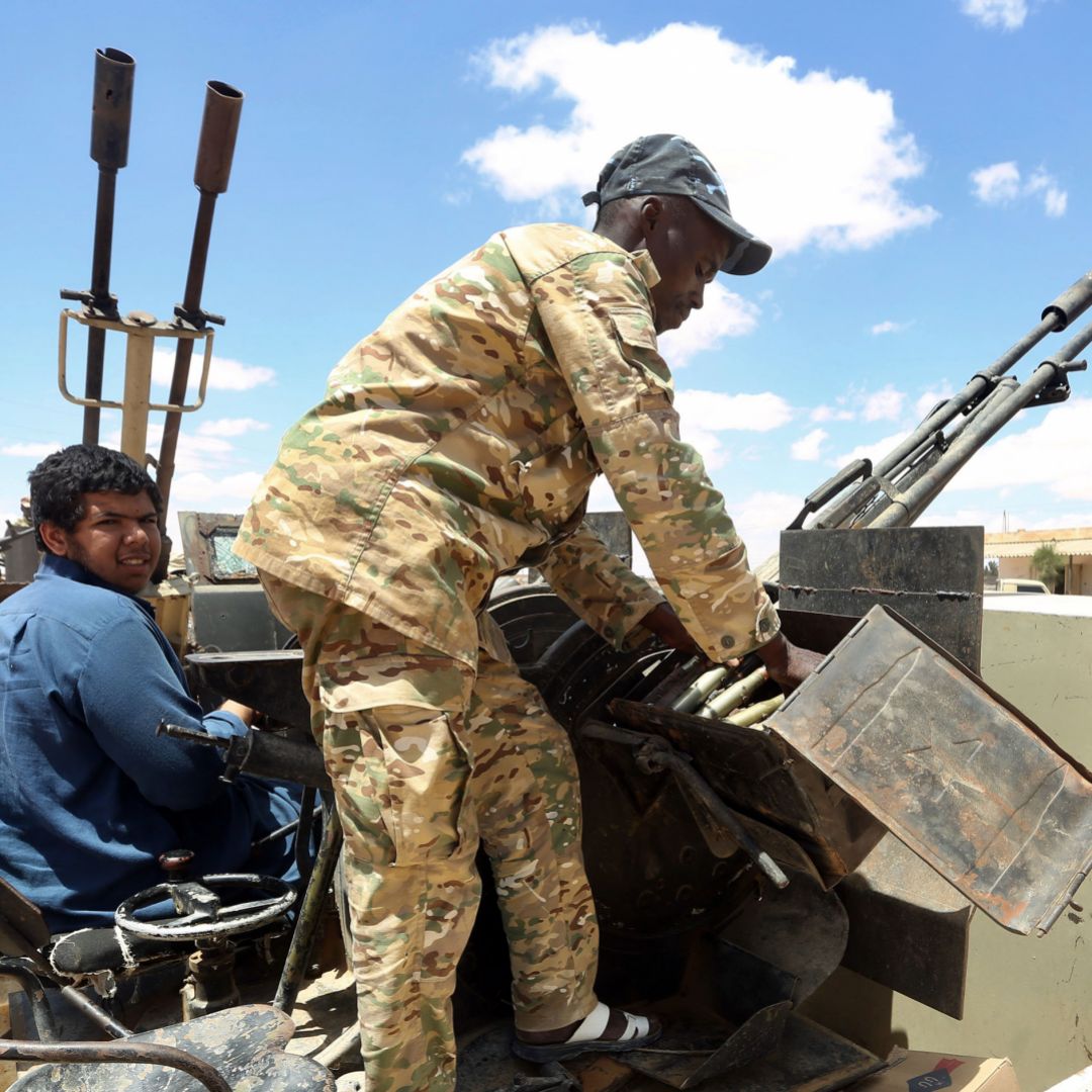 Fighters aligned with Libya's internationally-recognized Government of National Accord (GNA) patrol a village located halfway between Tripoli and Benghazi on July 20, 2020.