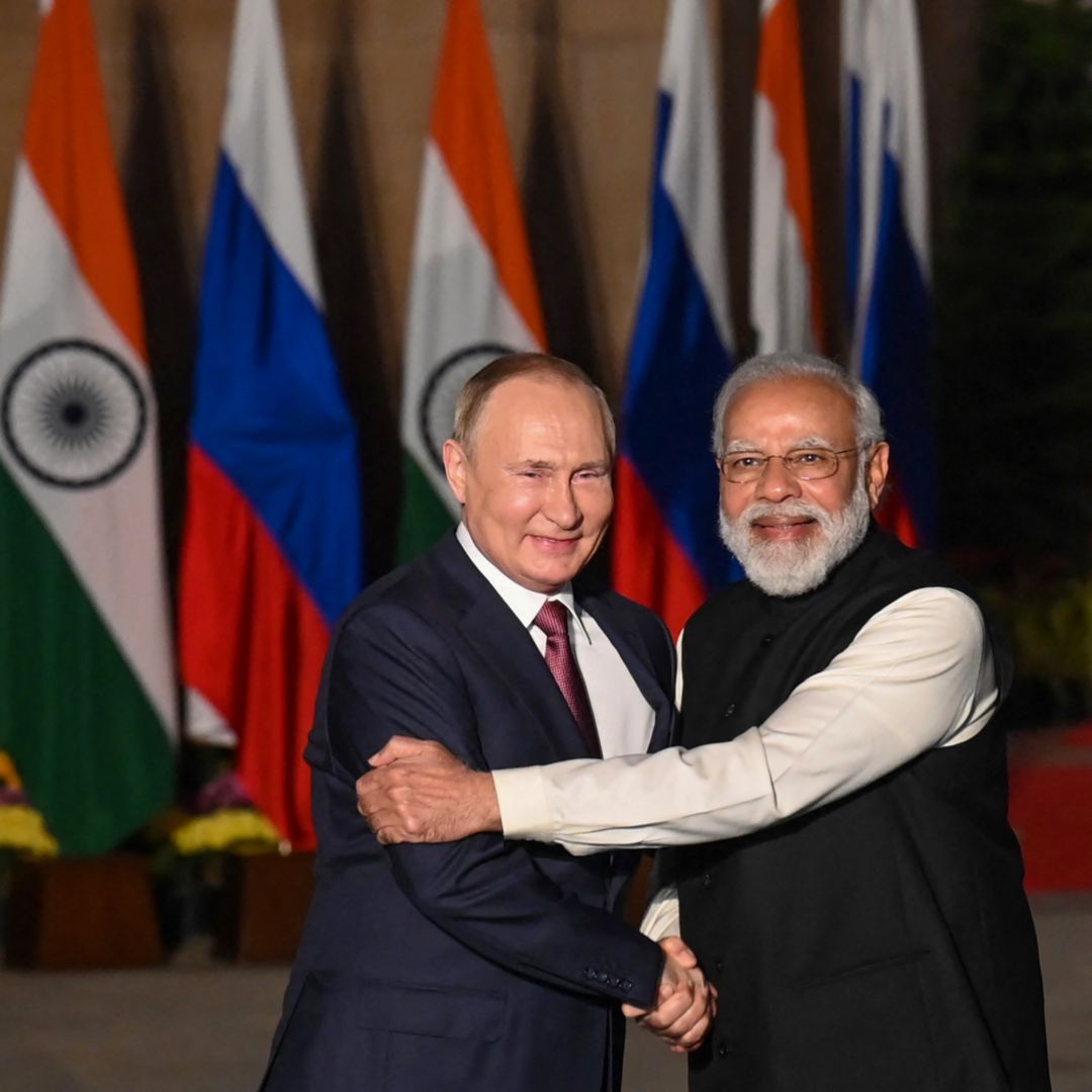 India's Prime Minister Narendra Modi (R) greets Russian President Vladimir Putin (L) before a meeting at Hyderabad House in New Delhi, India, on Dec. 6, 2021.