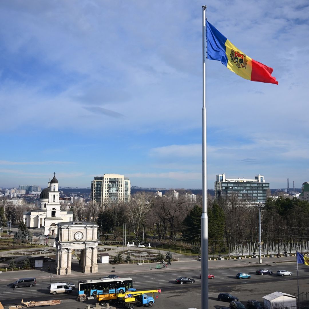 The Moldovan flag flutters near government buildings in Chisinau on Jan. 17, 2025. 