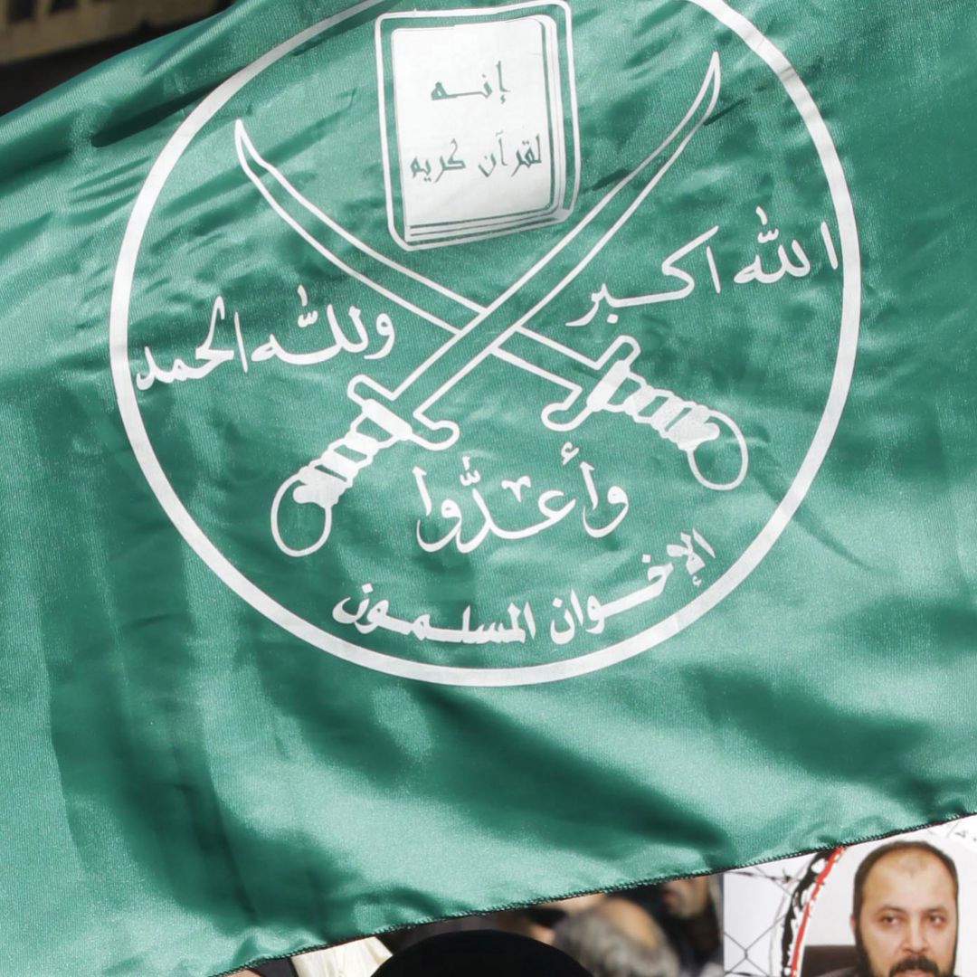 Supporters of the Muslim Brotherhood in Jordan hold the movement's flag during a demonstration in the capital, Amman, on Nov. 28, 2014. Supporters of the Muslim Brotherhood in Jordan hold the movement's flag during a demonstration in the capital, Amman, on Nov. 28, 2014.