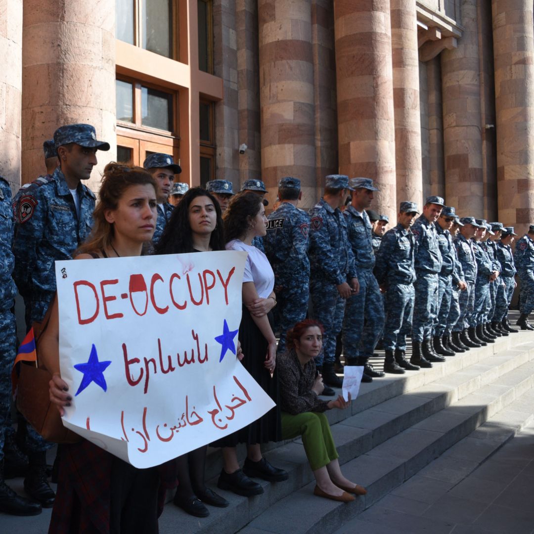 Armenians protest outside the government building in central Yerevan to urge the government to respond to the Azerbaijani military operation launched against the breakaway Nagorno-Karabakh region on Sept. 19, 2023.