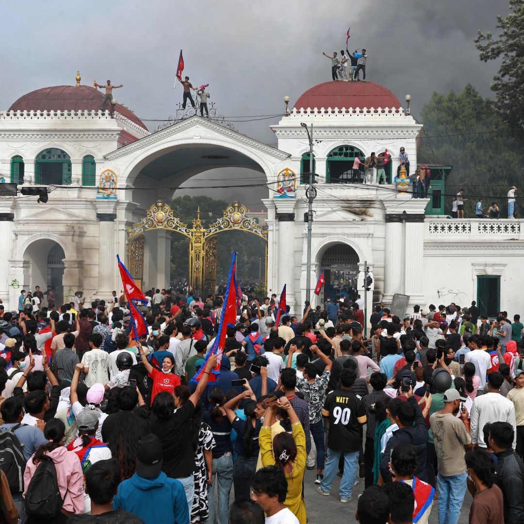 Protesters gather at the Singha Durbar, the main administrative building for the Nepal government, in Kathmandu on Sept. 9, 2025. 