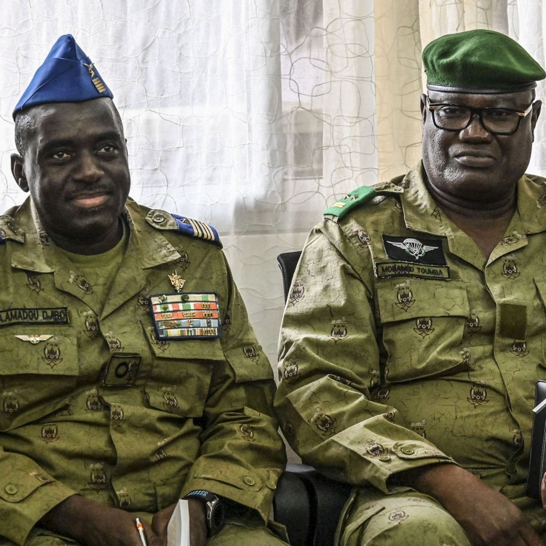 Mohamed Toumba (R), one of the generals who ousted Nigerien President Mohamed Bazoum in July 2023, and military junta spokesperson Amadou Abdramane (L) look on in Niamey, Niger, on Sept. 4, 2023. 