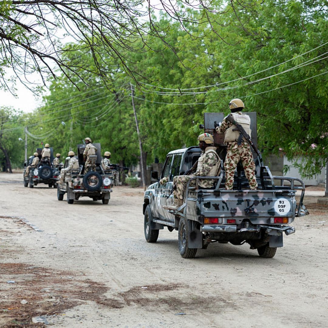 Nigerian soldiers from the Multinational Joint Task Force (MNJTF) drive in pick-ups during training at the Sector 3 MNJTF military base headquarters in Monguno, Borno state, Nigeria, on July 5, 2025. 
