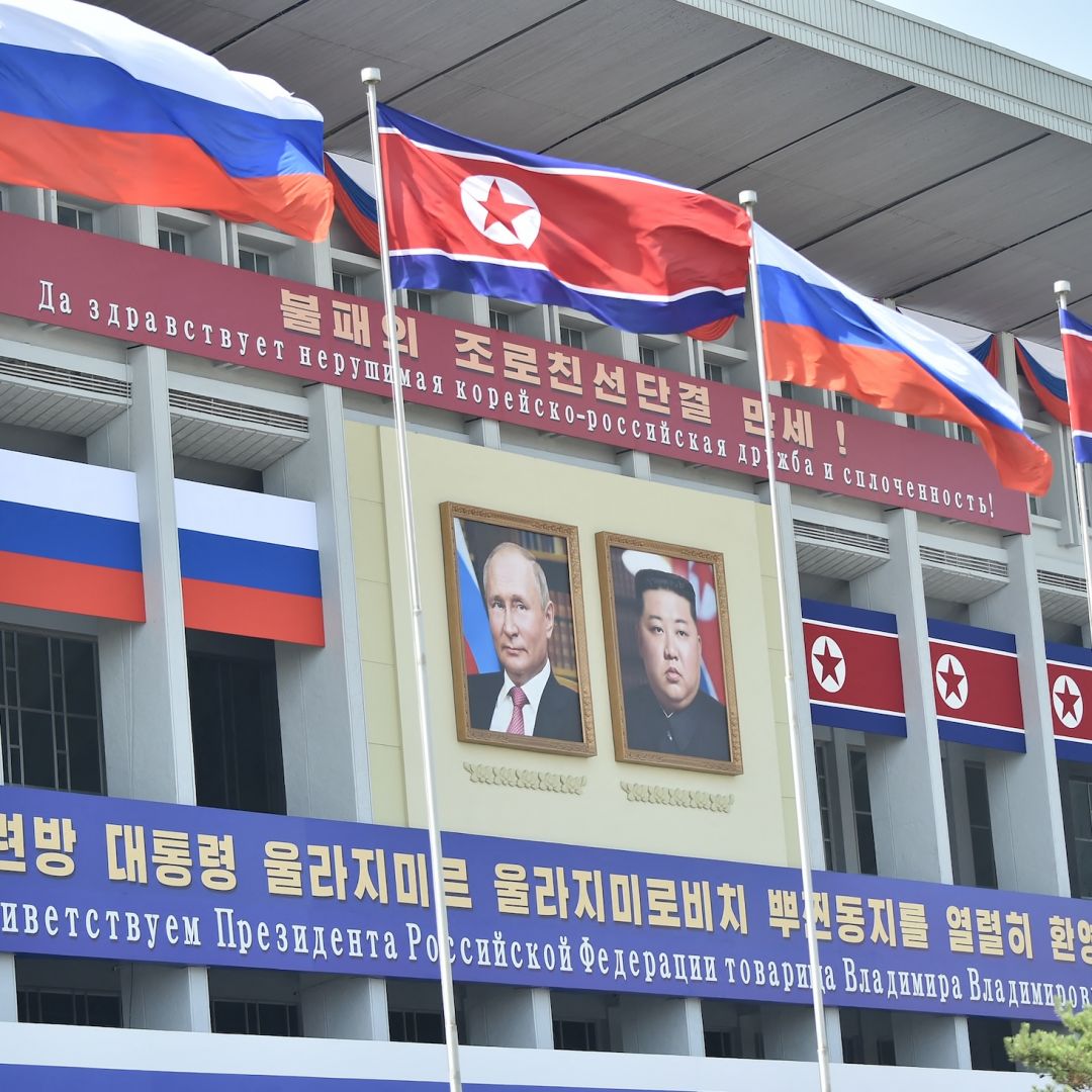 Portraits of Russian President Vladimir Putin (left) and North Korean leader Kim Jong Un are displayed in Pyongyang, North Korea, for Putin's visit to the country on June 20, 2024. 