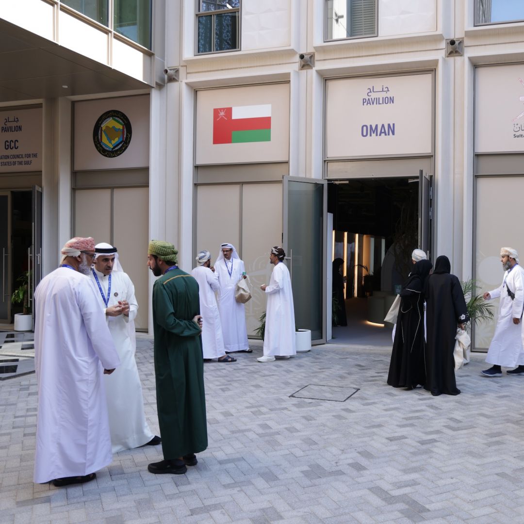 Participants stand outside the pavilion of Oman as they attend day nine of the U.N. Climate Change Conference in Dubai, United Arab Emirates, on Dec. 9, 2023. 