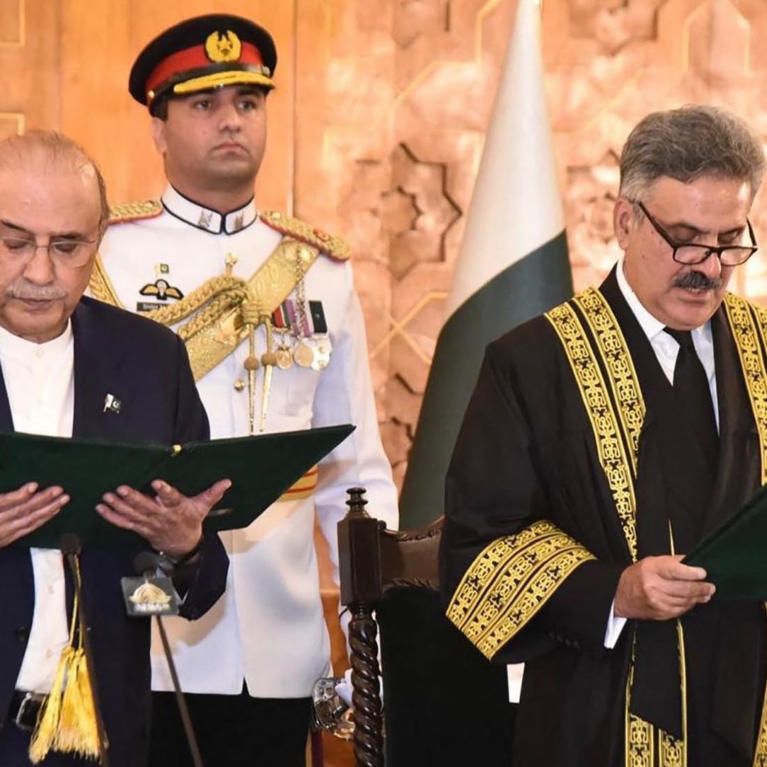 Pakistan's president administers the oath of office to Justice Yahya Afridi as Afridi is sworn in as chief justice in Islamabad on Oct. 26, 2024.