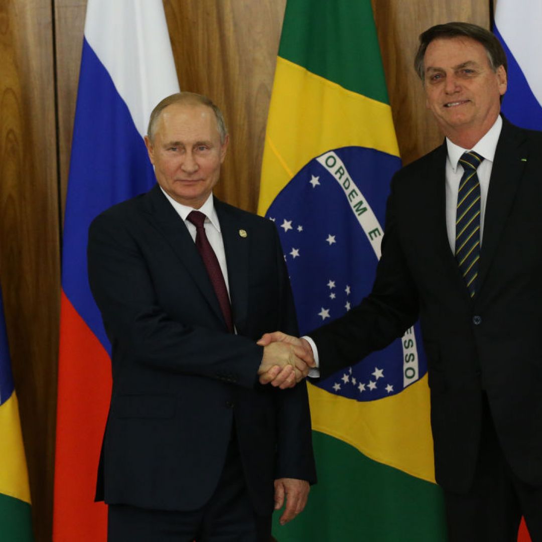 Russian President Vladimir Putin (L) greets Brazilian President Jair Bolsonaro on Nov. 14, 2019, in Brasilia, Brazil, on the sidelines of a BRICS summit. Brazilian President Jair Bolsonaro will visit Russia on Feb. 14-17 in an effort to boost relations between the two countries. Russian President Vladimir Putin (L) greets Brazilian President Jair Bolsonaro on Nov. 14, 2019, in Brasilia, Brazil, on the sidelines of a BRICS summit.