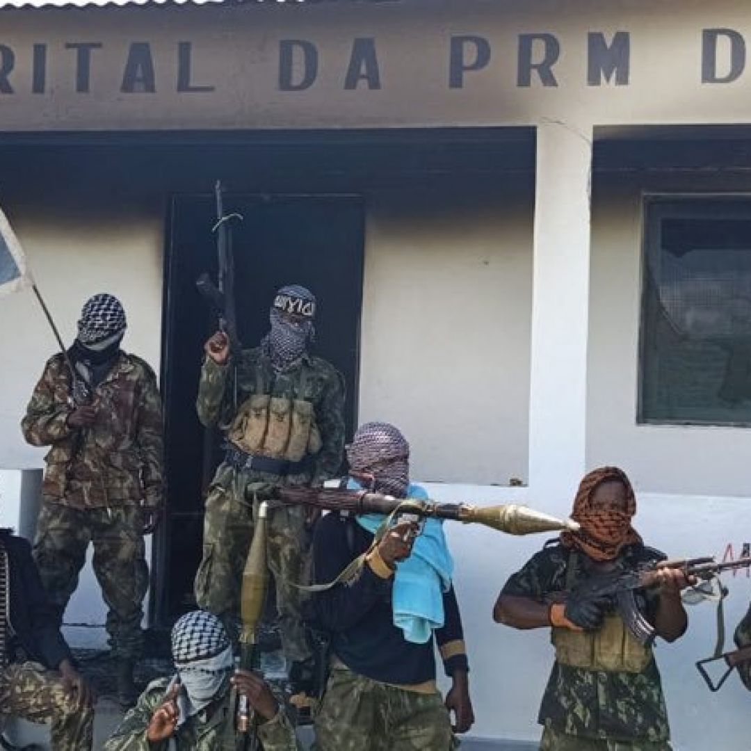 A member of ISCAP is seen holding a so-called Prophet's Banner on March 24 in Quissanga, Mozambique.