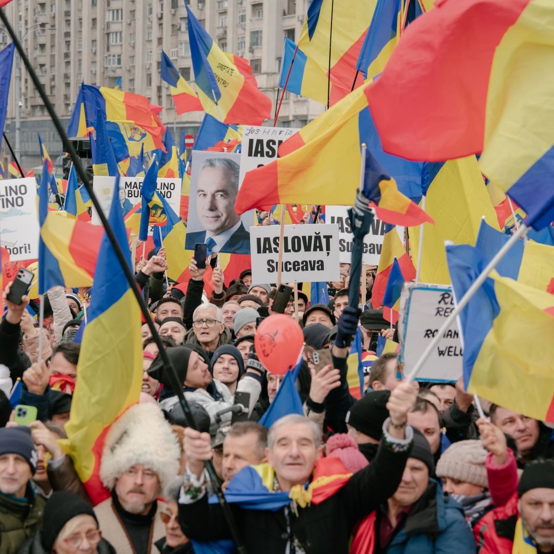 Supporters of the far-right Romanian politician Calin Georgescu take part in an anti-government protest in Bucharest on March 1, 2025. 