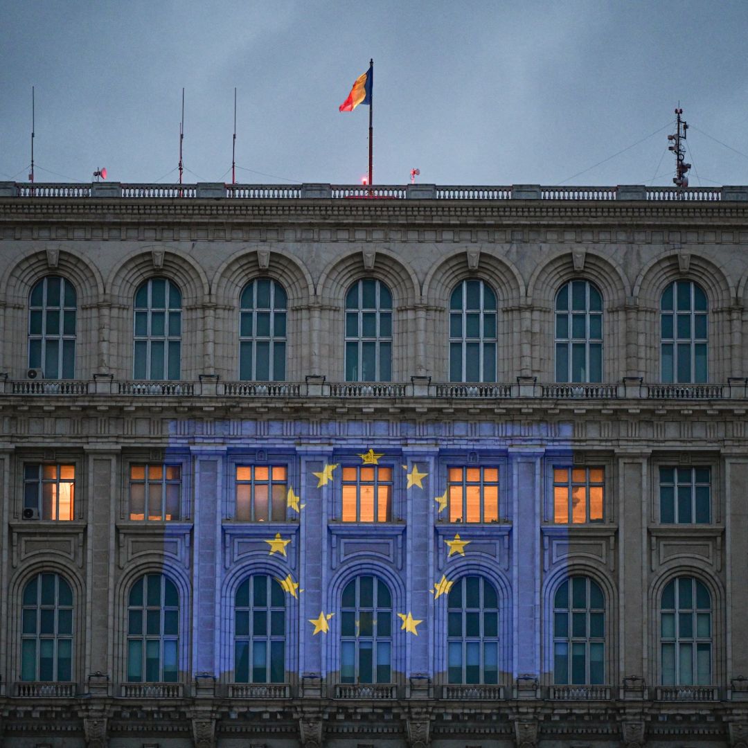 The EU flag is projected on the facade of Romania's parliament building in Bucharest on the eve of Europe Day on May 8, 2024. 