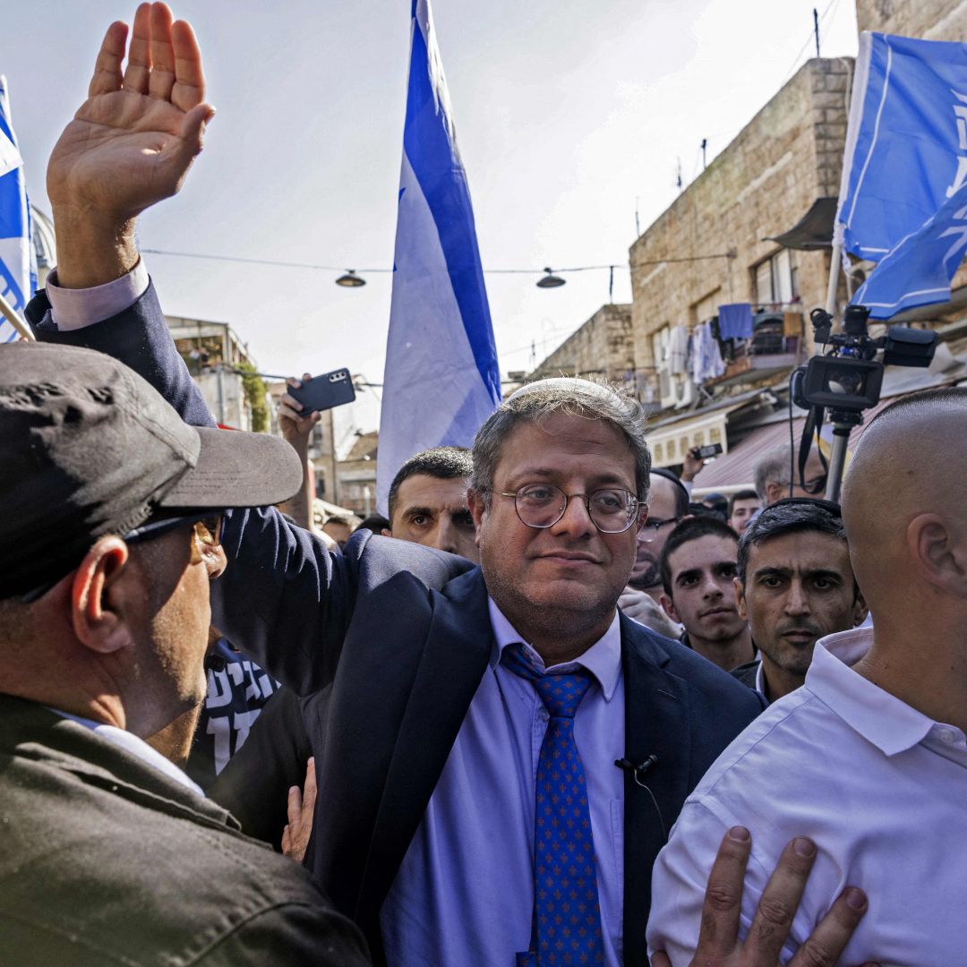 Israeli far-right lawmaker and Otzma Yehudit leader Itamar Ben-Gvir (C) greets supporters during a campaign rally Oct. 28, 2022, in Jerusalem's Mahane Yehuda Market. On Nov. 1, Israelis will go to the polls for the fifth time since 2019. Israeli far-right lawmaker and Otzma Yehudit leader Itamar Ben-Gvir (C) greets supporters during a campaign rally Oct. 28, 2022, in Jerusalem's Mahane Yehuda Market.