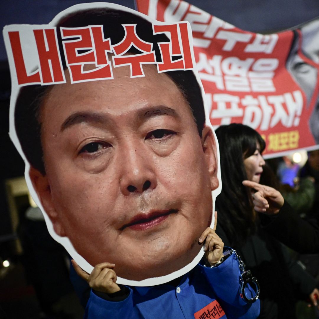 A sign reading ''leader of insurgents'' on a photo of South Korean President Yoon Suk Yeol's face is held up during a protest calling for Yoon's ouster in Seoul, South Korea, on Dec. 8, 2024. 