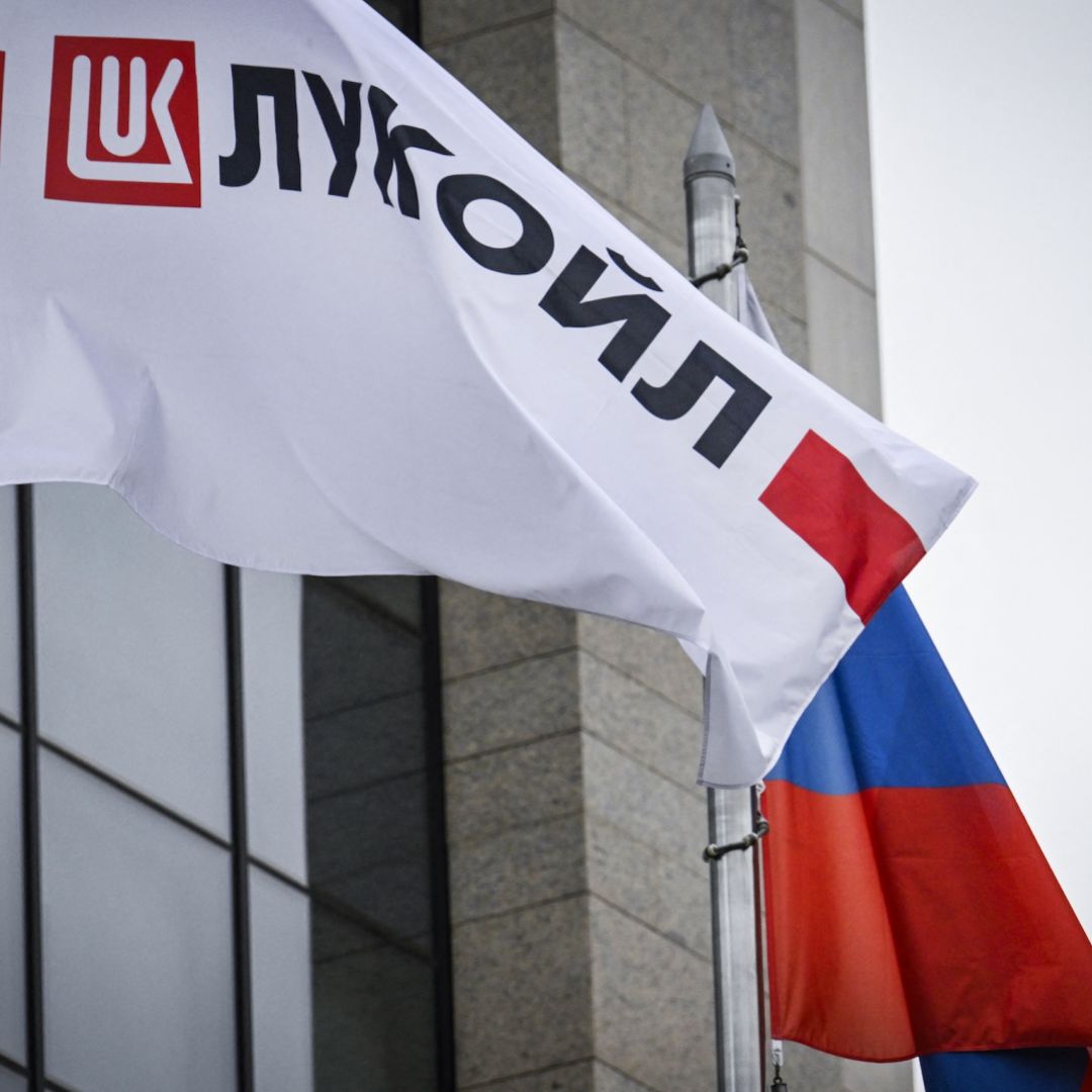 A flag displaying the logo for Russia's Lukoil oil giant flies near a Russian flag in Moscow on Oct. 23, 2025. A flag displaying the logo for Russia's Lukoil oil giant flies near a Russian flag in Moscow on Oct. 23, 2025.