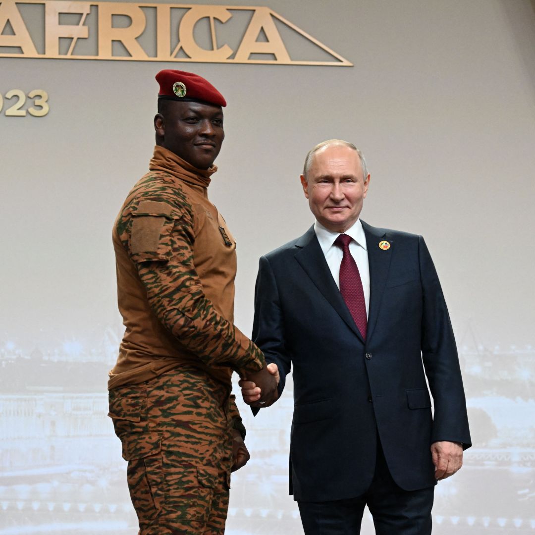 Russian President Vladimir Putin greets Burkina Faso's junta leader Capt. Ibrahim Traore during a welcoming ceremony at the second Russia-Africa summit in Saint Petersburg, Russia, on July 27, 2023.