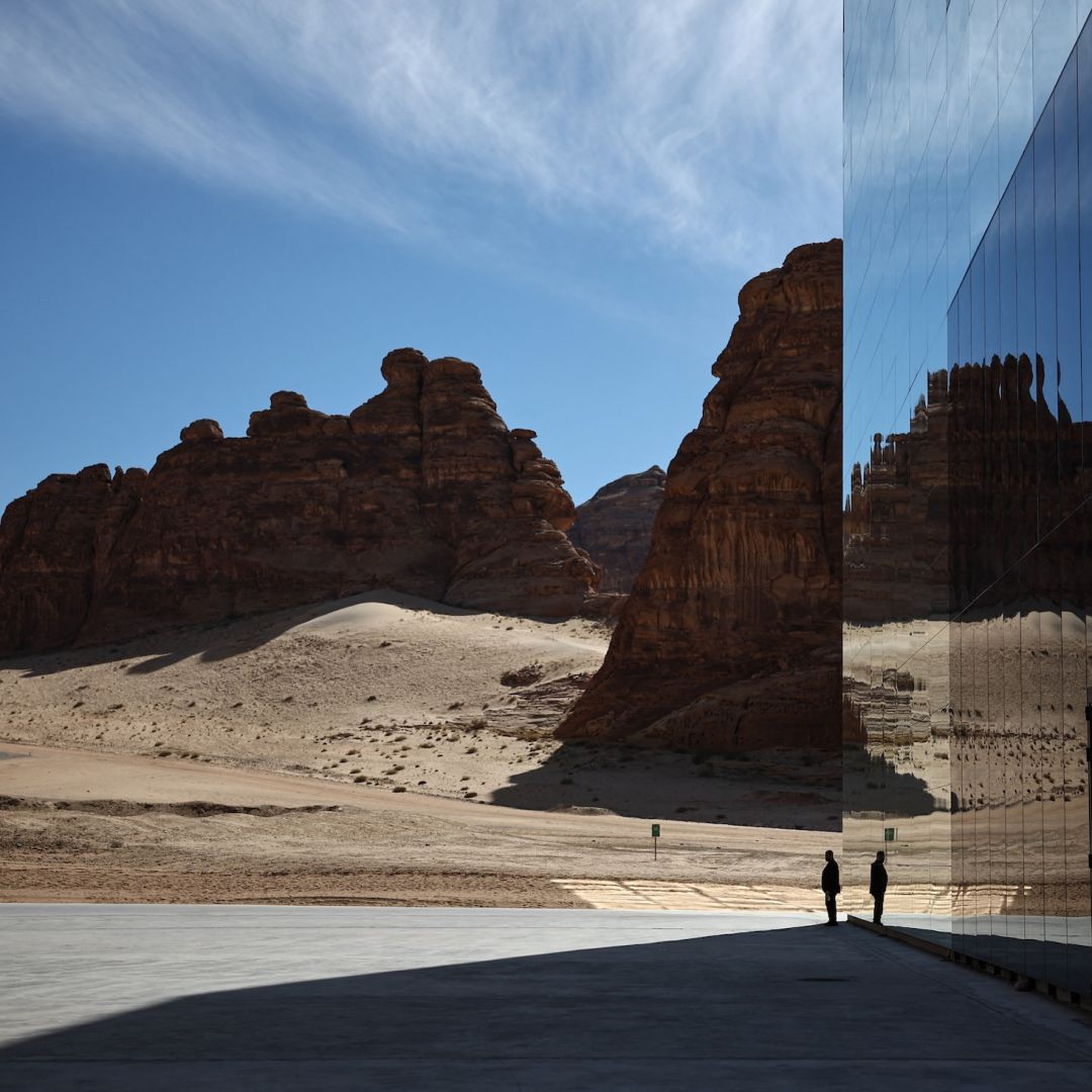 A man walks in front of the Maraya (Mirror), the world's largest mirrored building, in the desert canyon of Ashar Valley in Saudi Arabia's northwestern Al-Ula desert on Jan. 29, 2024.