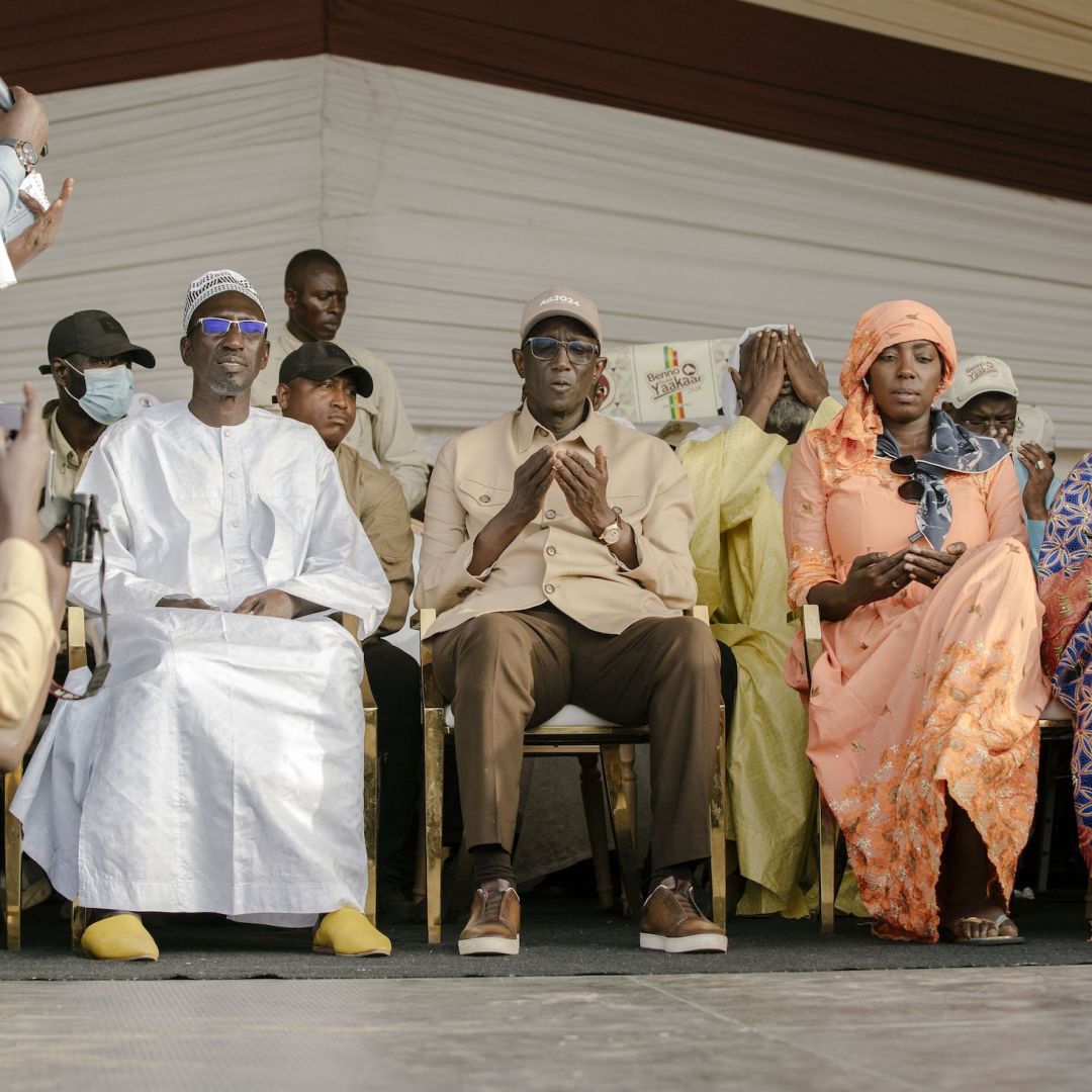 Former Senegalese Prime Minister Amadou Ba (center), the ruling coalition candidate in Senegal's 2024 presidential election, prays ahead of a campaign meeting in Diourbel, Senegal, on March 19, 2024. 