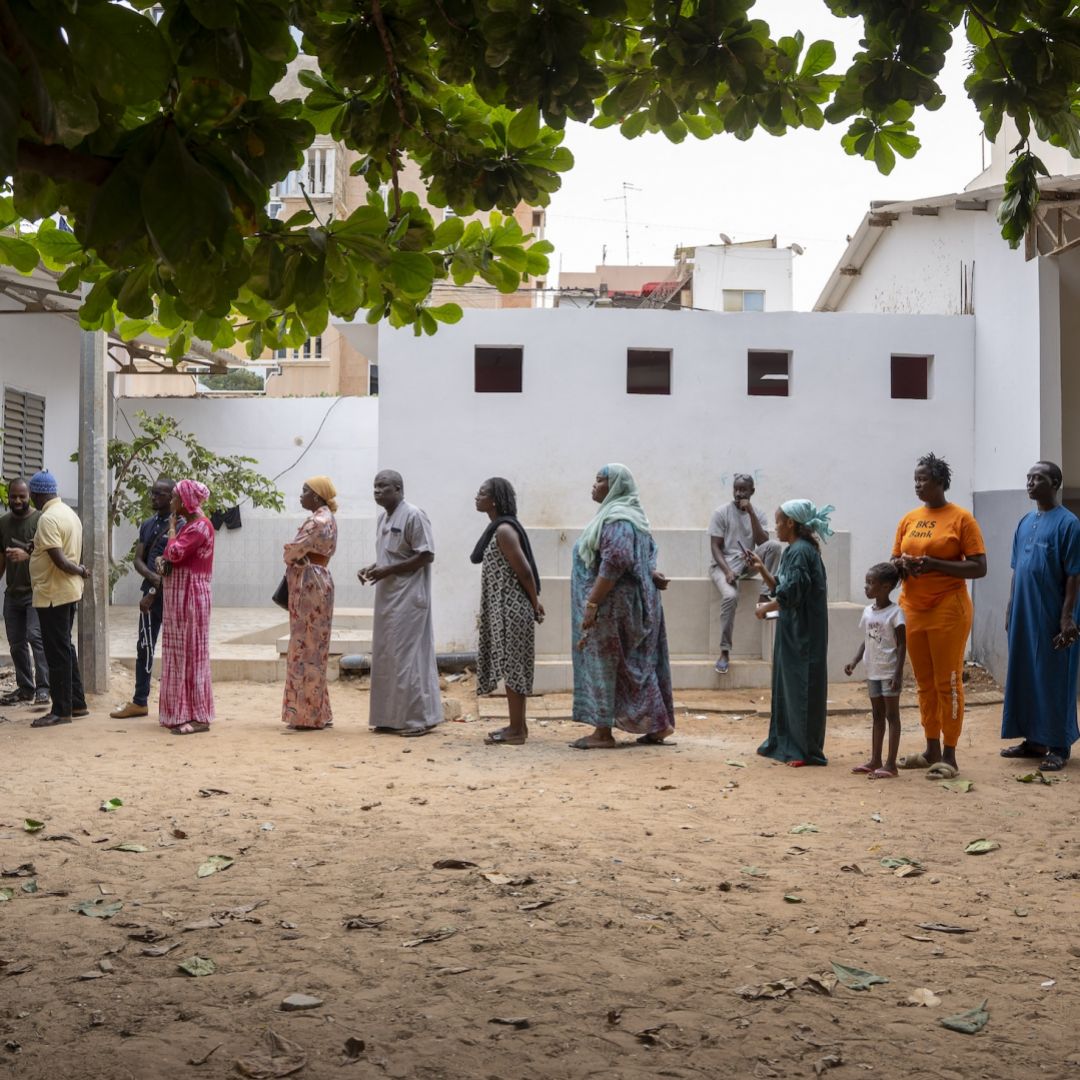 Voters wait in line outside a voting station in Dakar on Nov. 17, 2024, during Senegal's parliamentary elections.