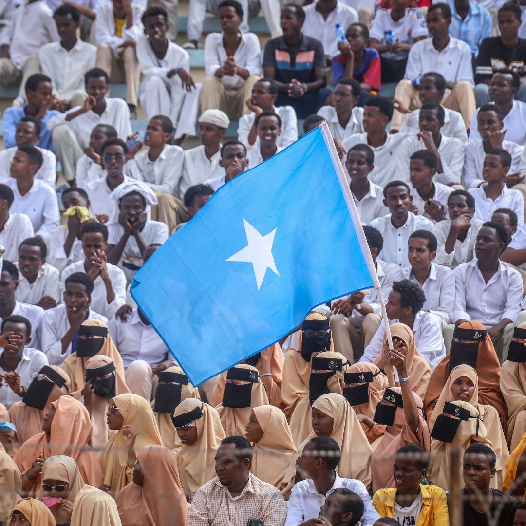 Residents wave Somali flags as they attend a rally denouncing Israel's recognition of the breakaway region of Somaliland at Mogadishu Stadium in Mogadishu, Somalia, on Dec. 30, 2025. 