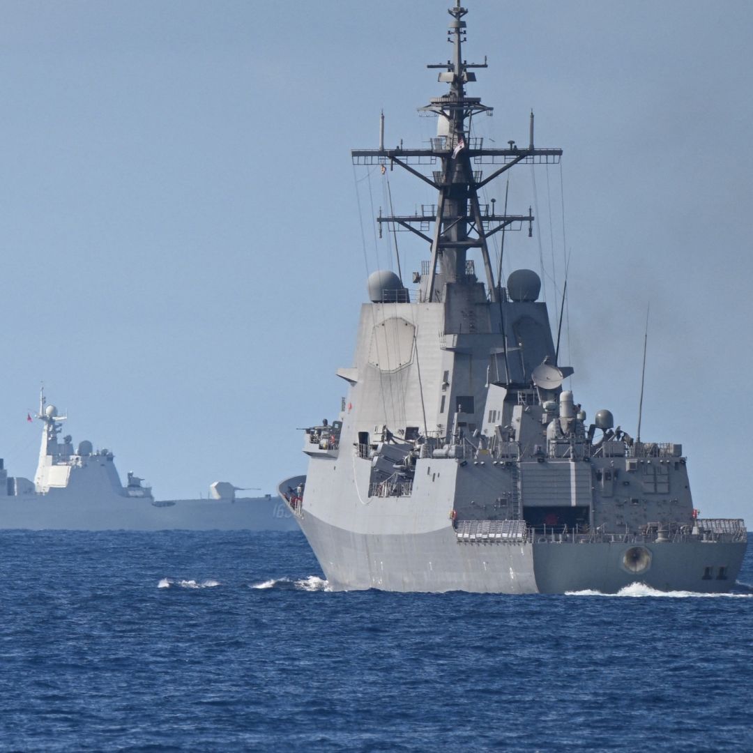 A Chinese navy ship (background left) is seen while an Australian navy ship (right) takes part in a maritime cooperative activity with the Philippines and Canada in the disputed waters of the South China Sea on Sept. 3, 2025. A Chinese navy ship (background left) is seen while an Australian navy ship (right) takes part in a maritime cooperative activity with the Philippines and Canada in the disputed waters of the South China Sea on Sept. 3, 2025.