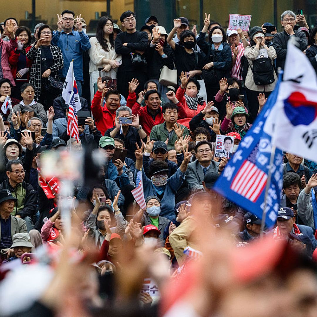 Supporters of Kim Moon Soo, the opposition candidate running in South Korea's June 3 presidential election, react during a campaign event in Seoul on May 19, 2025.