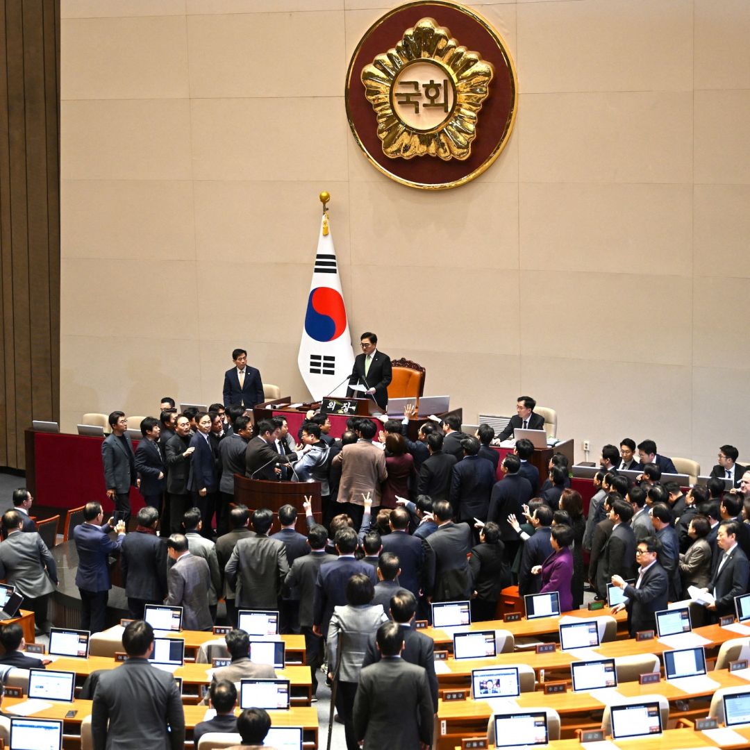 People Power Party lawmakers (bottom) argue with National Assembly Speaker Woo Won-shik (top) during the plenary session for the impeachment vote of acting president Han Duck-soo on Dec. 27, 2024, at the National Assembly in Seoul, South Korea.