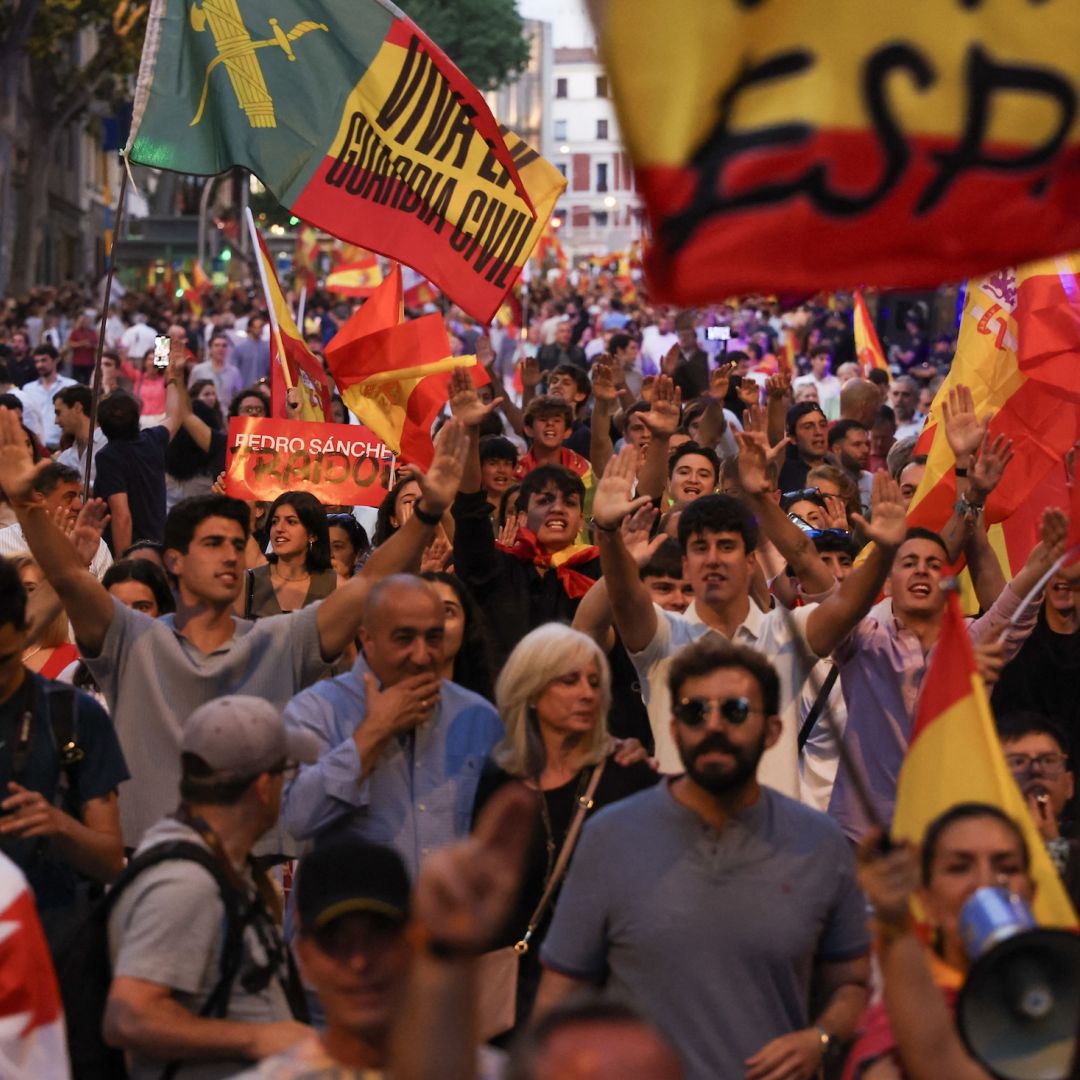 Supporters of the far-right Vox party wave flags and shout slogans during a protest against Spanish Prime Minister Pedro Sanchez in Madrid, on June 13, 2025. Supporters of the far-right Vox party wave flags and shout slogans during a protest against Spanish Prime Minister Pedro Sanchez in Madrid, on June 13, 2025.