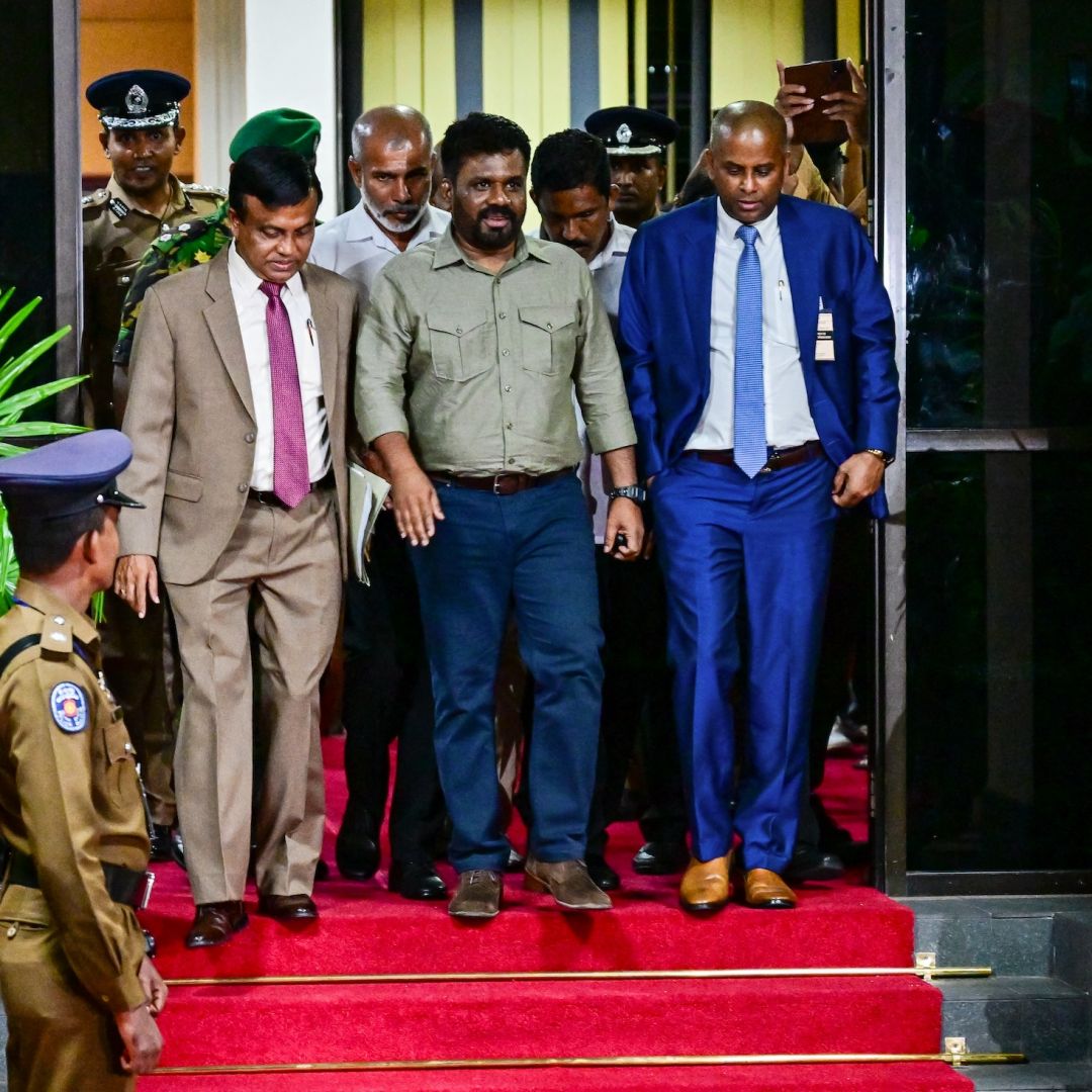 Anura Kumara Dissanayake (center) gestures as he leaves the office of Sri Lanka's Election Commission in Colombo on Sept. 22, 2024, following his victory in the country's presidential election. 