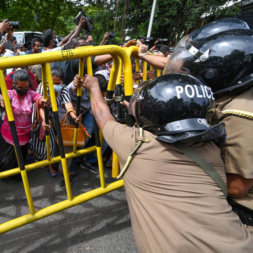 Opposition activists outside Sri Lankan Prime Minister Ranil Wickremesinghe's private residence on June 22, 2022, in Colombo, Sri Lanka.