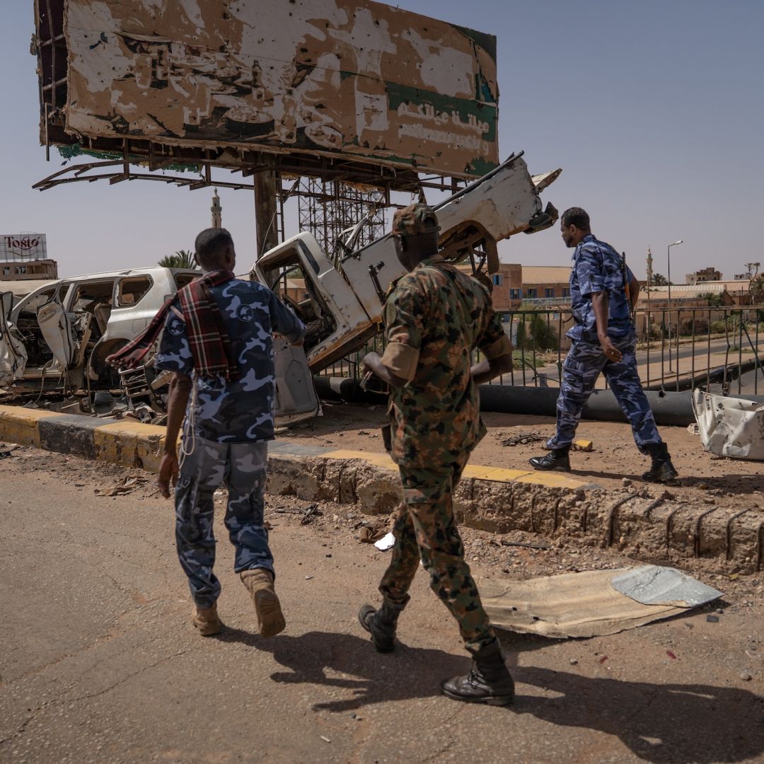 Sudanese Armed Forces soldiers are seen on the now-disabled Shambat Bridge in Khartoum. 