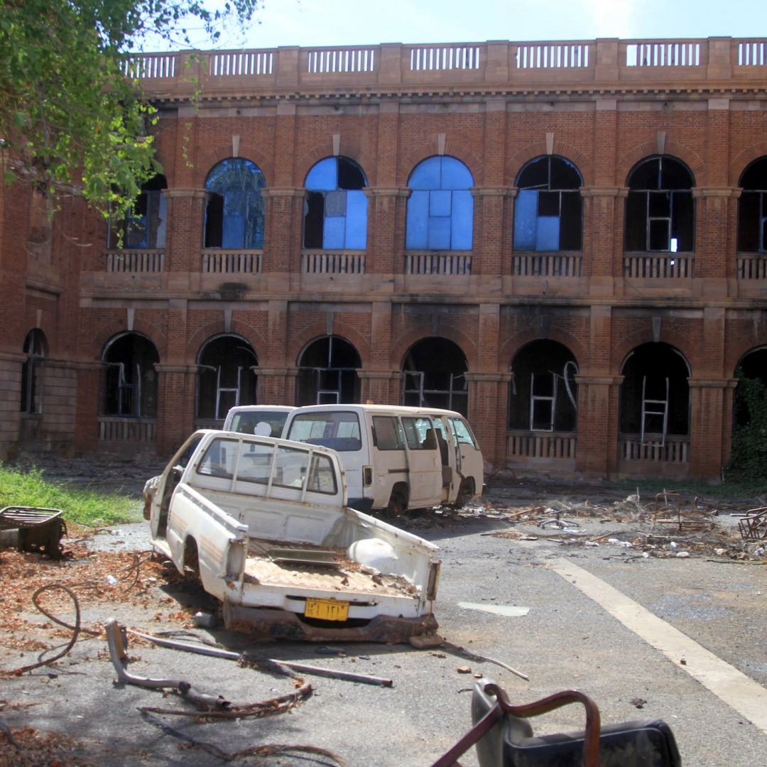 Destroyed vehicles are strewn outside Sudan's finance ministry building in the capital Khartoum on Jan. 17, 2026, after nearly three years of devastating war in the country.