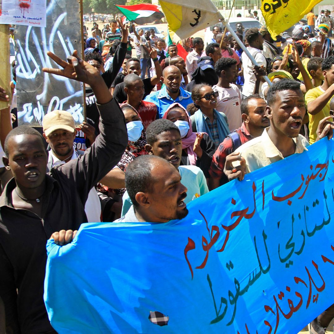 Demonstrators march in a protest in the area south of Sudan's capital Khartoum on Oct. 25, 2022, on the first anniversary of the military coup. Demonstrators march in a protest in the area south of Sudan's capital Khartoum on Oct. 25, 2022, on the first anniversary of the military coup.