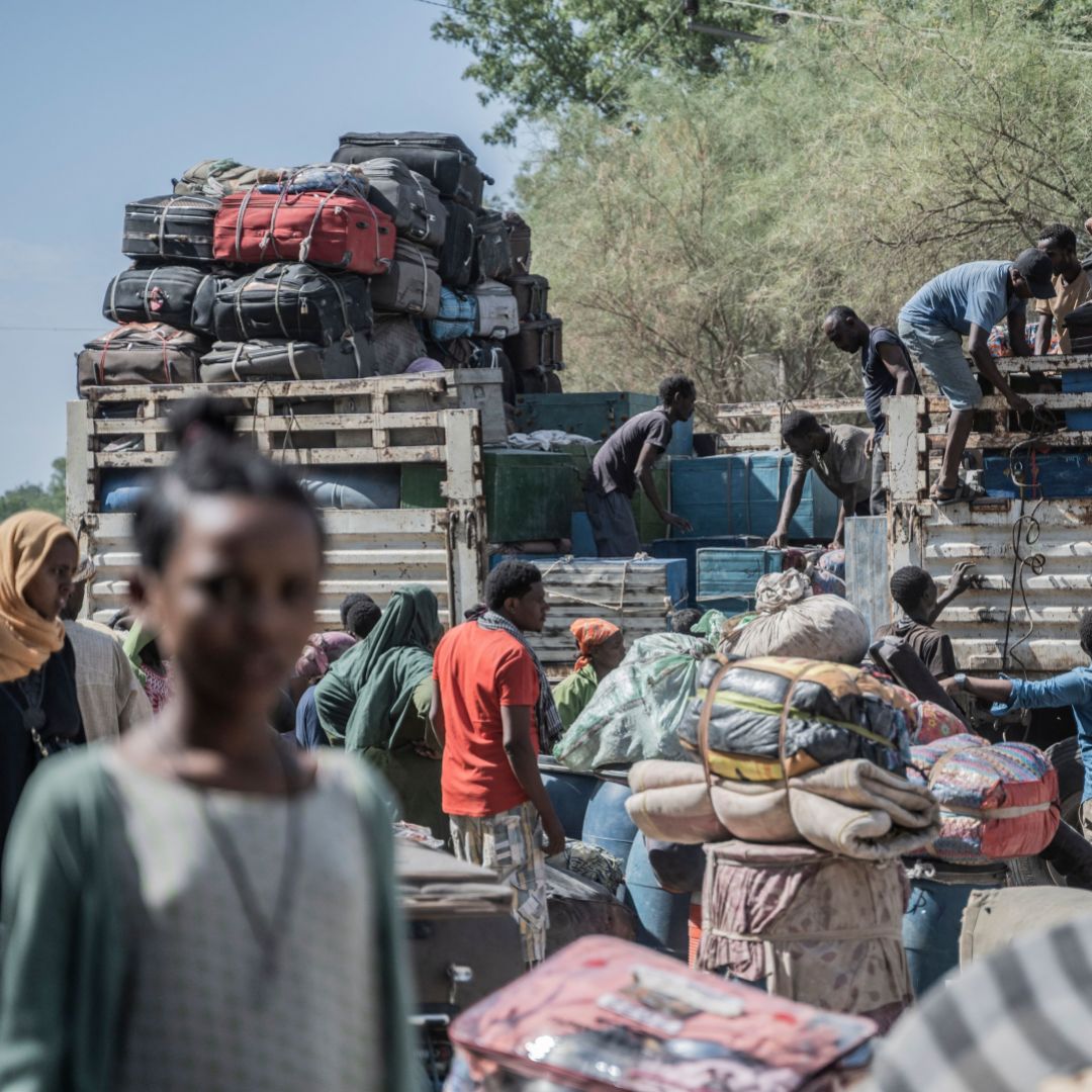 Workers load luggage onto a vehicle that belongs to refugees from Sudan who entered Ethiopia in Metema on May 5, 2023.