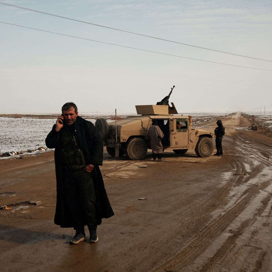 A fighter of the Syrian Democratic Forces stands on a road between the Syrian villages of Safa and Tell Brak on Jan. 24, 2026. A fighter of the Syrian Democratic Forces stands on a road between the Syrian villages of Safa and Tell Brak on Jan. 24, 2026.
