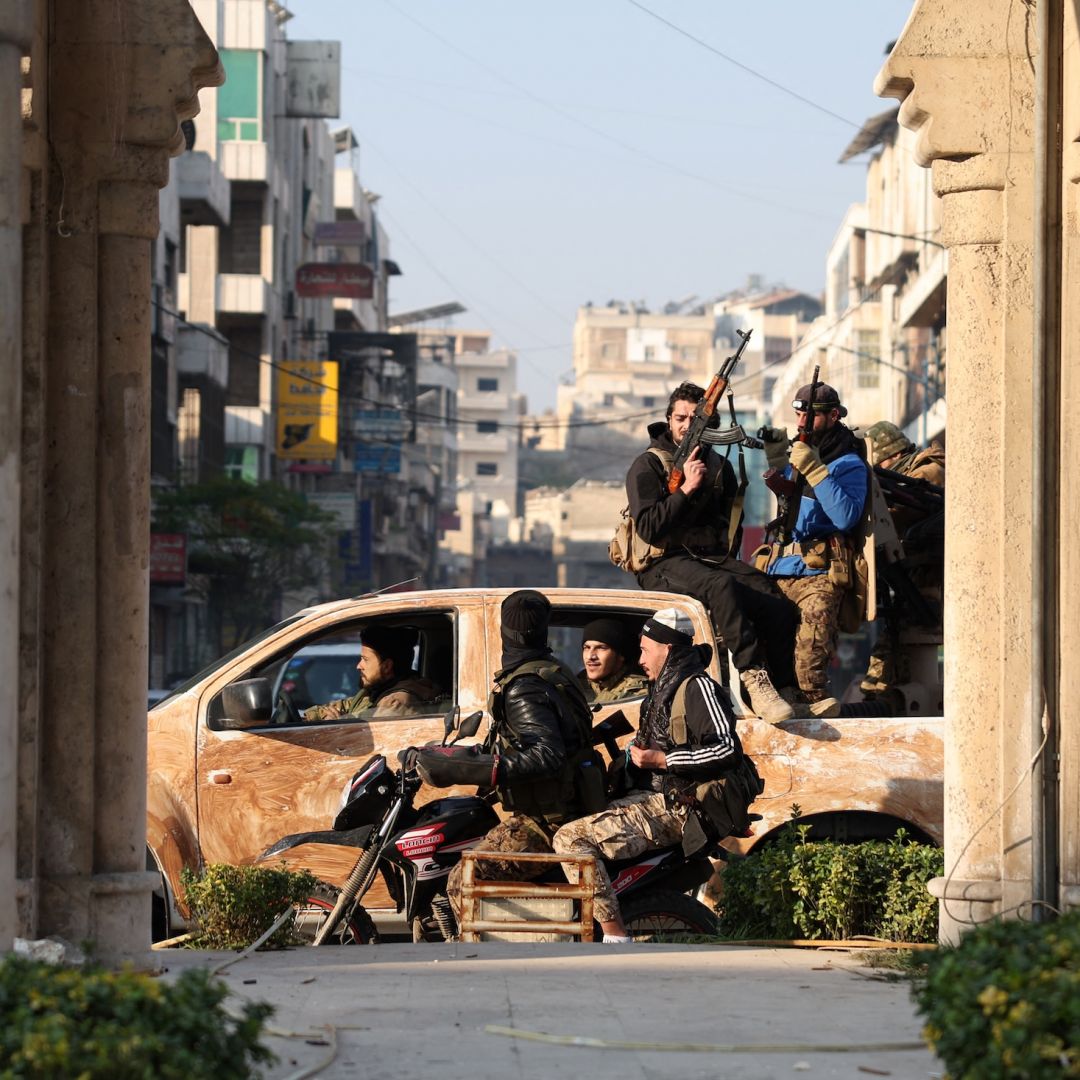 Rebels patrol the streets of Hama after they captured the central Syrian city on Dec. 6, 2024. 