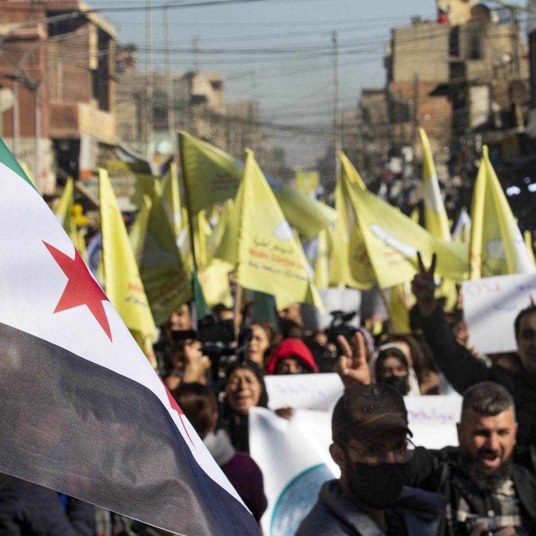 Syrian Kurds wave independence-era flags in support of the U.S.-backed, Kurdish-led Syrian Democratic Forces on Dec. 19, 2024, in the northeastern Syrian city of Qamishli.