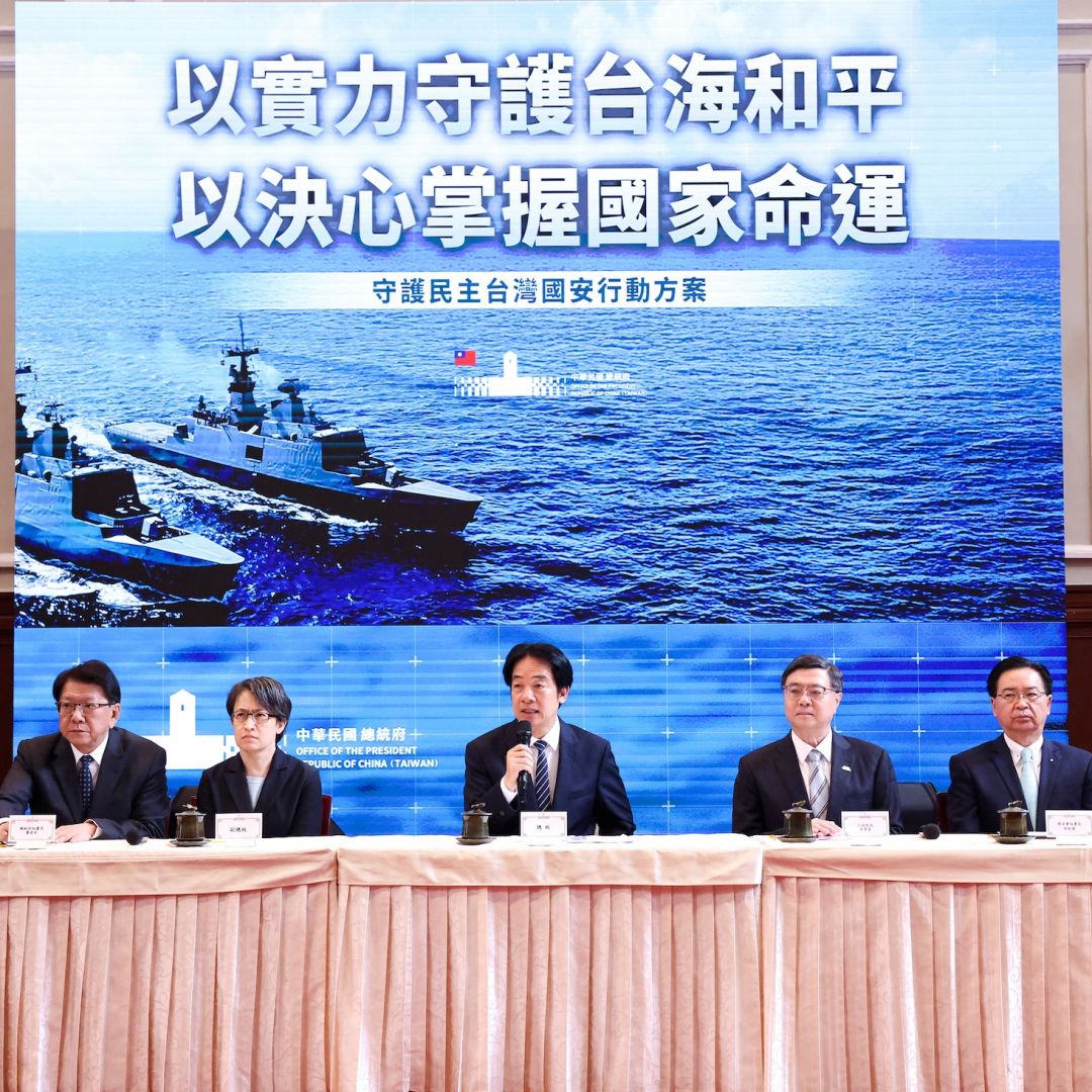 Taiwanese President William Lai (center), flanked by other top officials in his government, discusses plans to propose a $40 billion supplemental defense budget during a news conference in Taipei on Nov. 26, 2025.