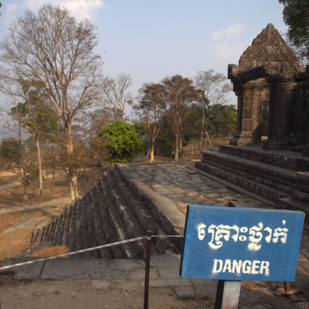 A ''Danger'' sign warns visitors about a fragile structure within the grounds of the Preah Vihear temple in Cambodia.