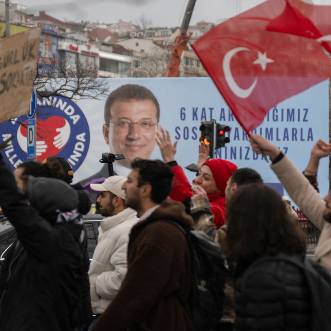 People wave Turkish national flags as they protest in Istanbul on March 20, 2025, following Mayor Ekrem Imamoglu's detention over a corruption probe.