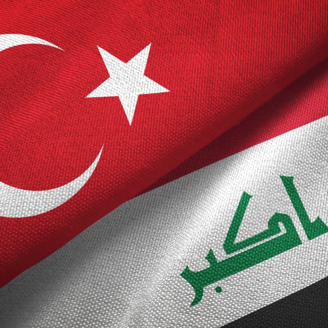 Iraq and Turkey's flags together on a textile cloth fabric Iraq and Turkey's flags together on a textile cloth fabric