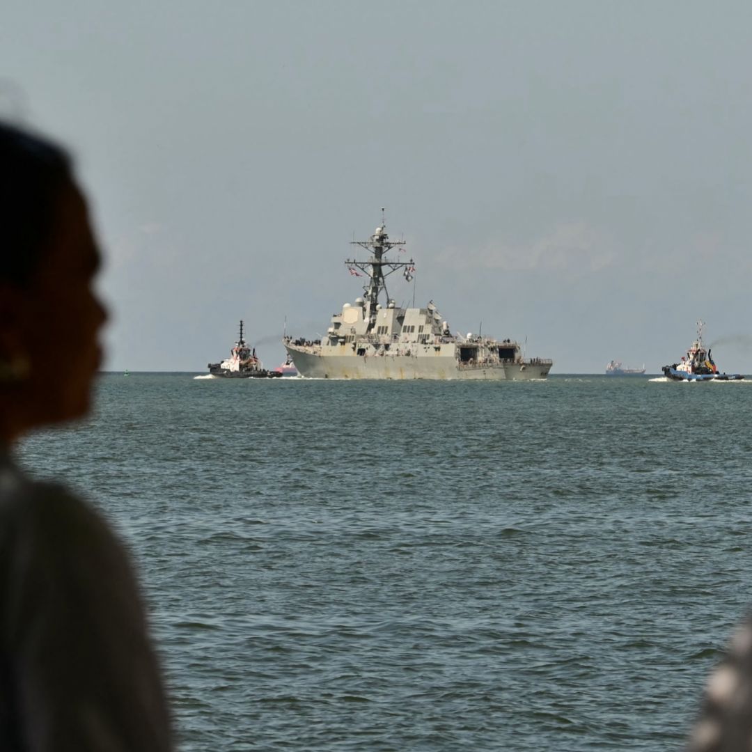 People watch the USS Gravely, a Navy warship, departing the Port of Spain on Oct. 30, 2025. The U.S. warship arrived in Trinidad and Tobago on Oct. 26, 2025, for joint exercises near the coast of Venezuela, as Washington ratcheted up pressure on drug traffickers and Venezuelan leader Nicolas Maduro. People watch the USS Gravely, a Navy warship, departing the Port of Spain on Oct. 30, 2025. The U.S. warship arrived in Trinidad and Tobago on Oct. 26, 2025, for joint exercises near the coast of Venezuela, as Washington ratcheted up pressure on drug traffickers and Venezuelan leader Nicolas Maduro.