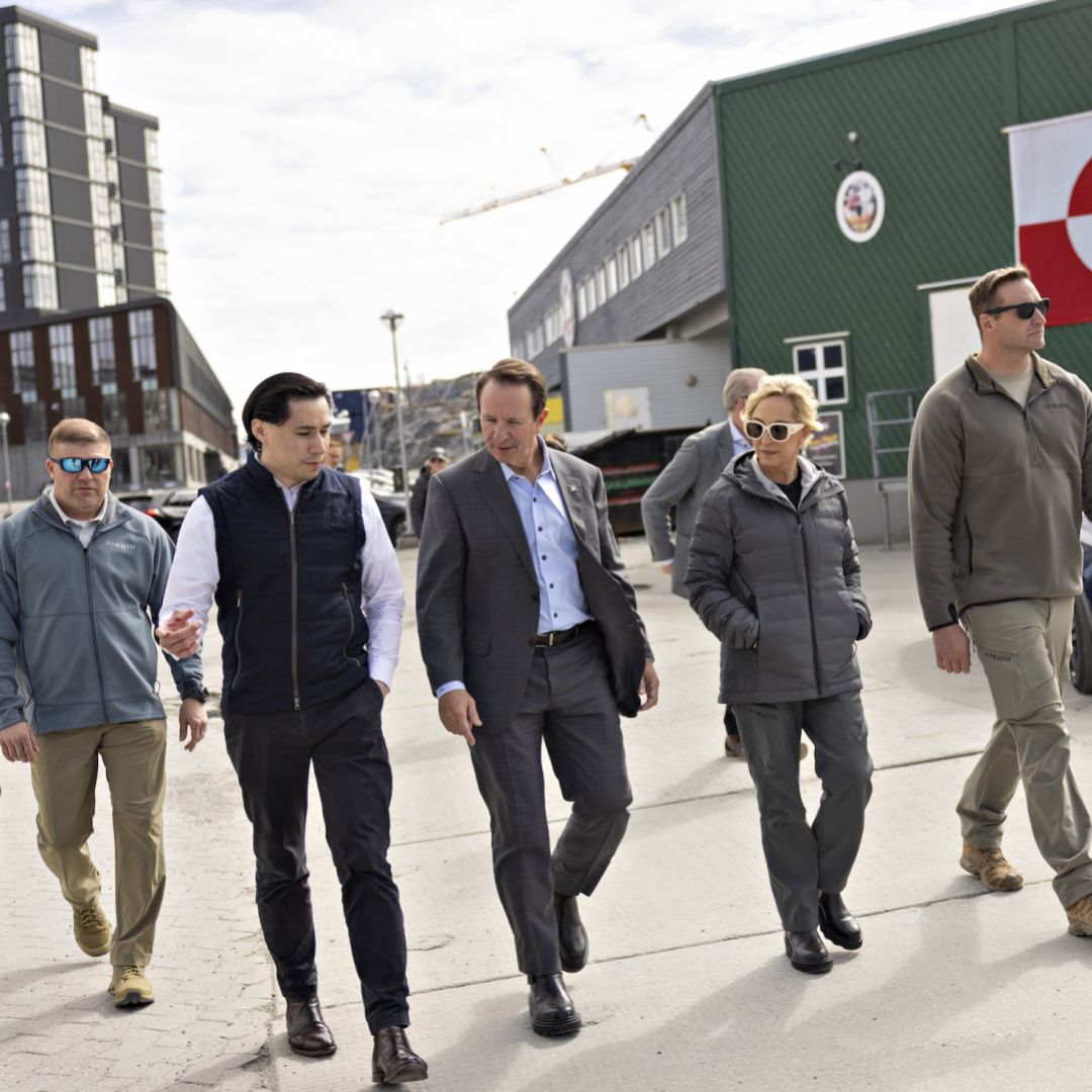 U.S. special envoy to Greenland, Republican Louisiana Governor Jeff Landry (center right), and Greenlandic mason and Trump supporter Jorgen Boassen (center left) are pictured in Nuuk, Greenland, on May 20, 2026, on the sidelines of the Future Greenland business fair. 