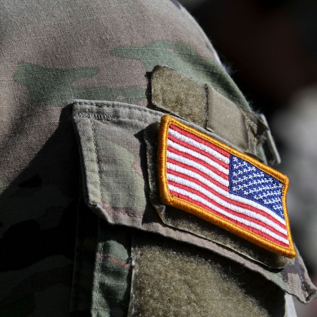 A U.S. flag is pictured on a soldier's uniform at the United States Army military training base in Grafenwoehr, southern Germany, on March 11, 2022.