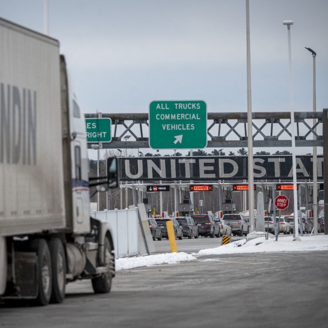 A truck drives toward the Canada-U.S. border crossing in Blackpool, Canada, on Feb. 2, 2025.