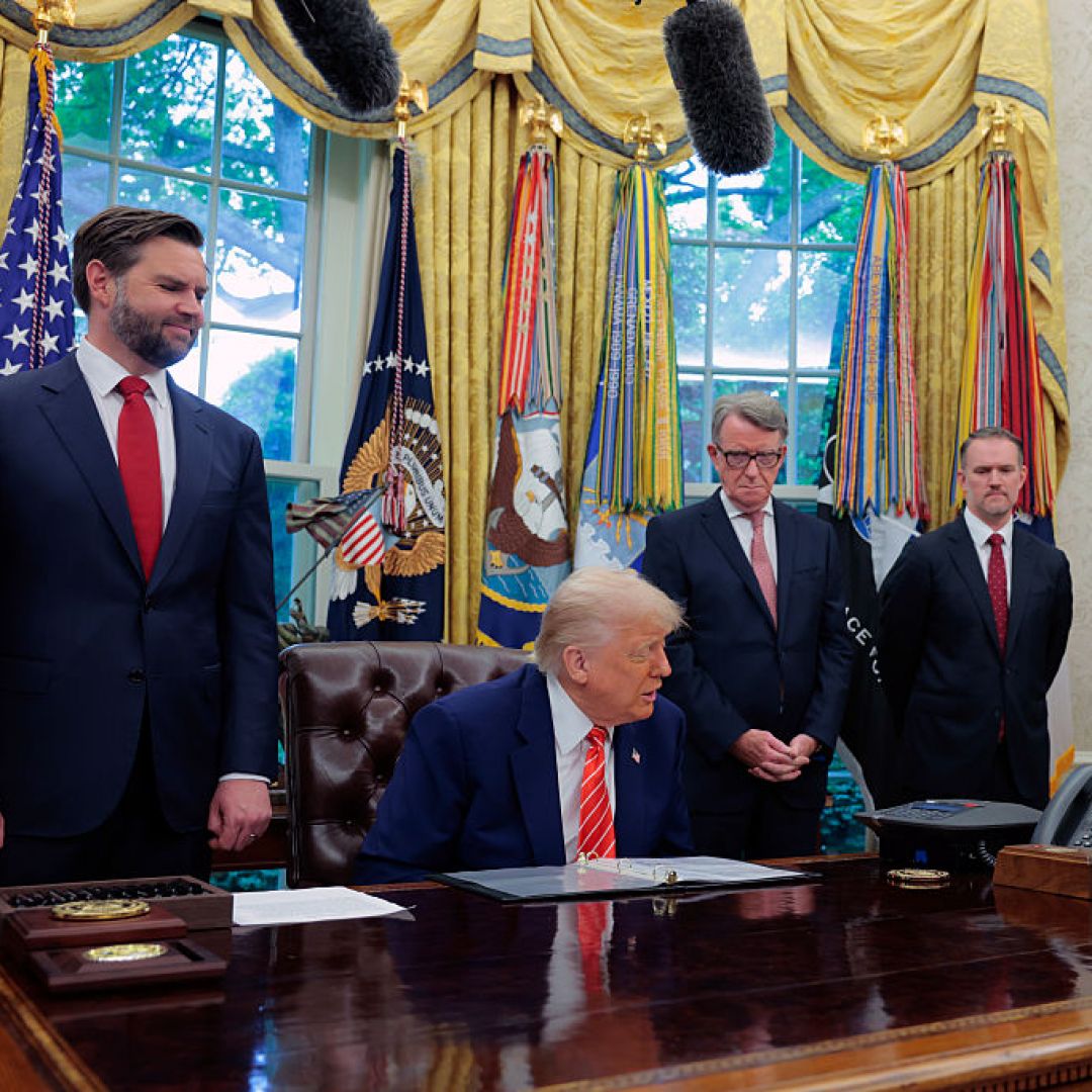 U.S. President Donald Trump -- flanked by Vice President JD Vance (left) and Peter Mandelson, the U.K. ambassador to the United States (right) -- holds a phone call with U.K. Prime Minister Keir Starmer in the Oval Office of the White House on May 8, 2025. U.S. President Donald Trump -- flanked by Vice President JD Vance (left) and Peter Mandelson, the U.K. ambassador to the United States (right) -- holds a phone call with U.K. Prime Minister Keir Starmer in the Oval Office of the White House on May 8, 2025.