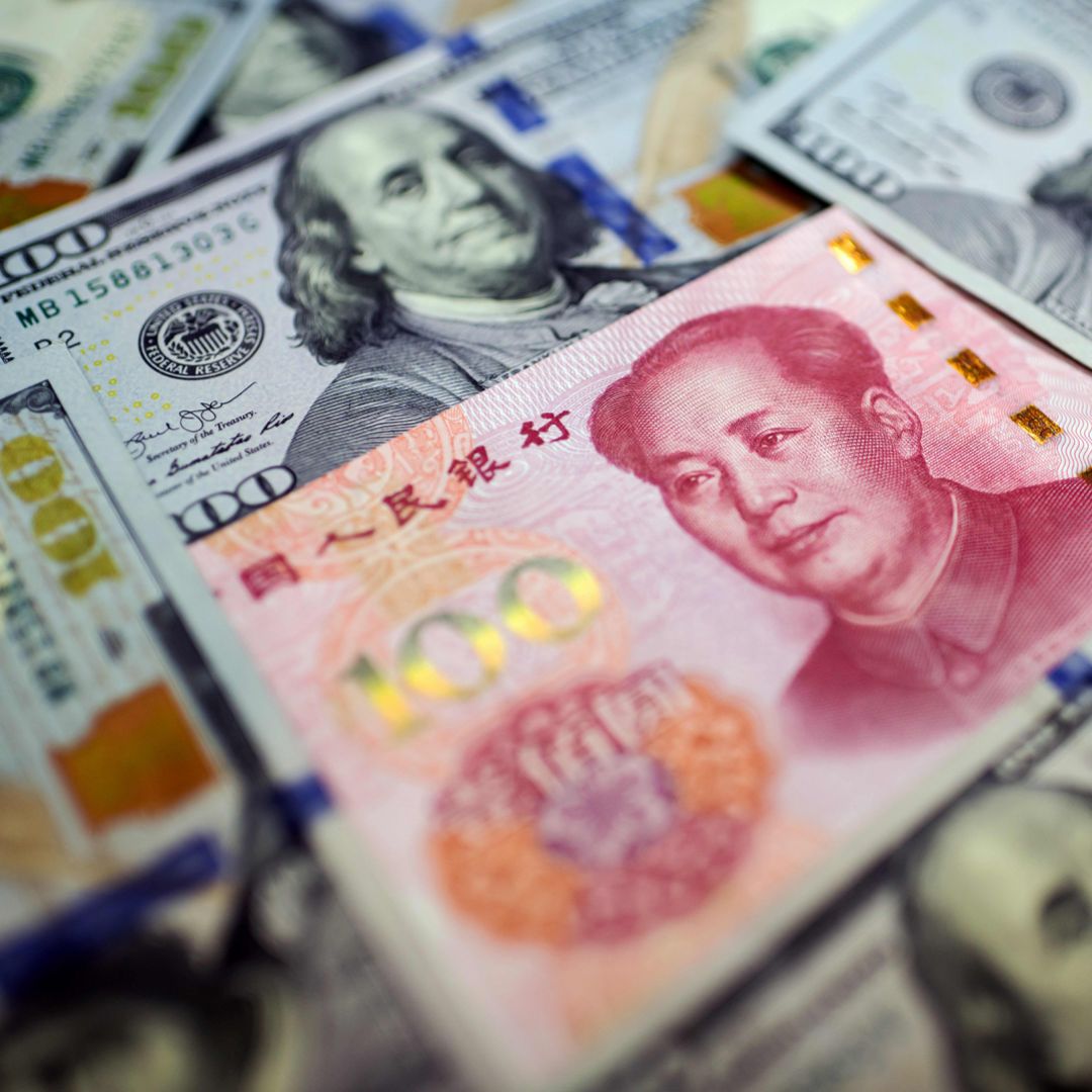 Chinese Yuan Surrounded By U.S. 100 Dollar Bills 