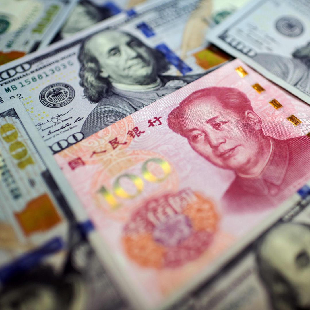 Chinese Yuan Surrounded By U.S. 100 Dollar Bills Chinese Yuan Surrounded By U.S. 100 Dollar Bills