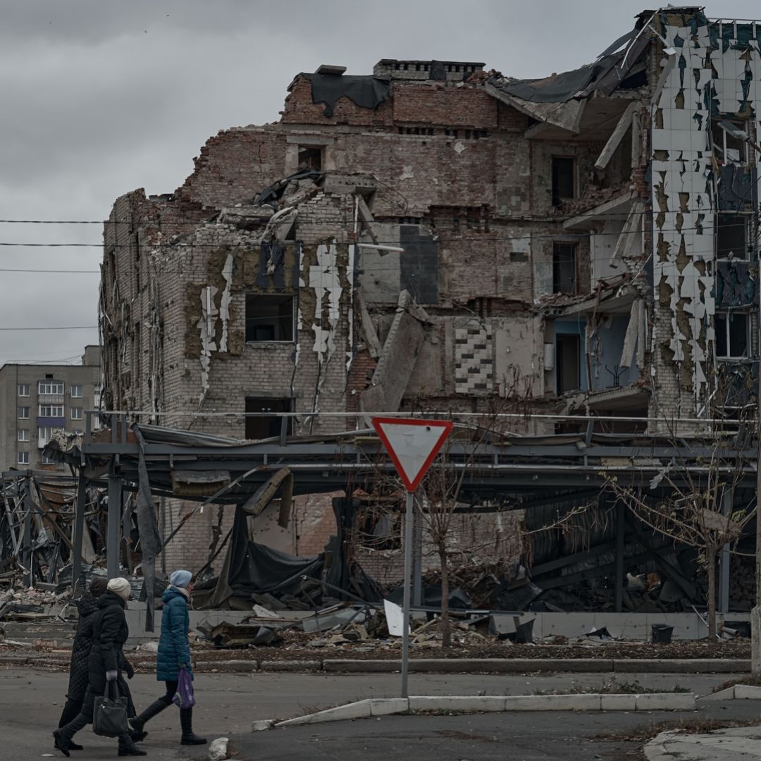 People walk by destroyed houses in Pokrovsk, Ukraine, on Nov. 16, 2024.