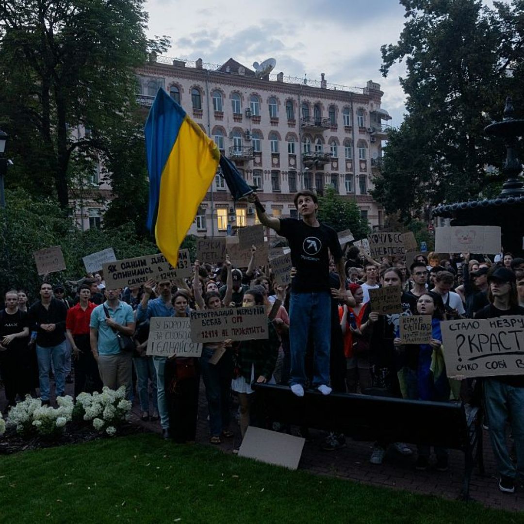 A protester holds a Ukrainian flag in downtown Kyiv on July 22, 2025, during a demonstration calling for President Volodymyr Zelensky to veto a law that reduces the powers of Ukraine's anti-corruption agencies. A protester holds a Ukrainian flag in downtown Kyiv on July 22, 2025, during a demonstration calling for President Volodymyr Zelensky to veto a law that reduces the powers of Ukraine's anti-corruption agencies.