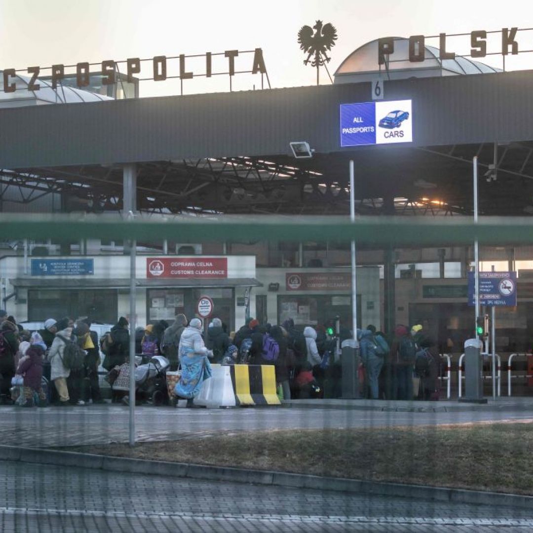 Refugees from Ukraine line up to enter Poland on Feb. 28 at the border crossing in Medyka, Poland.